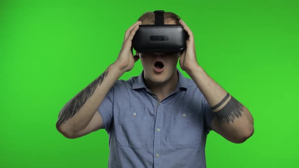 Man Using VR Headset Helmet To Play Game. Watching Virtual Reality 3d 360 Video. Chroma Key