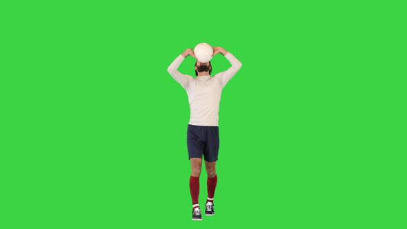 Volleyball Player Walking and Bouncing a Ball on a Green Screen Chroma Key