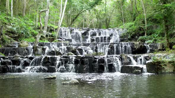 Beautiful stream and waterfall in forest at Namtok Samlan, Saraburi, Thailand - Slow Motion