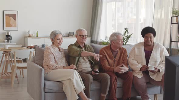 Diverse Senior People Watching TV
