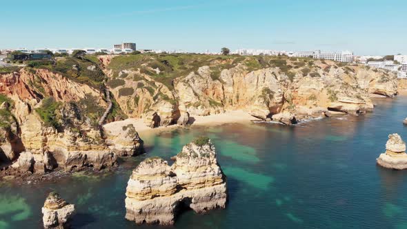 Beach, Sun, Sand, Sea and Solitude in Lagos , Algarve. Orbiting aerial shot