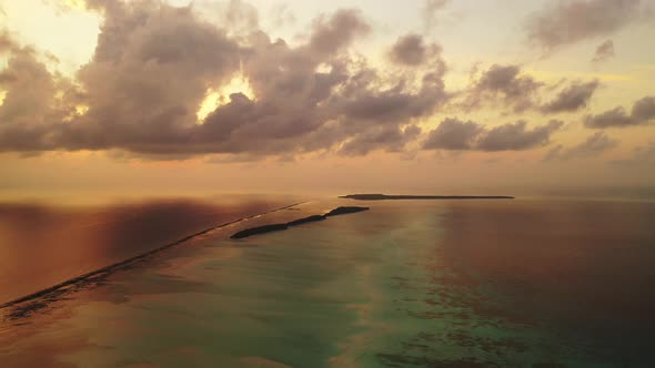 Wide flying abstract view of a white sandy paradise beach and turquoise sea background in high resol