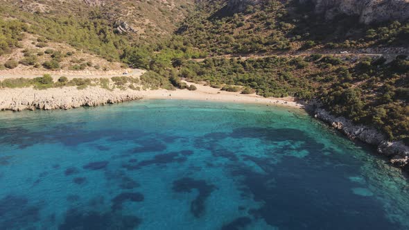 Aerial coastline of Datca with deep and crystal blue cove and clear turquoise water