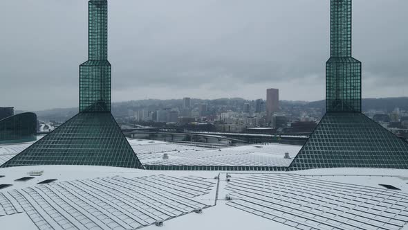 Flying Over Oregon Convention Center in the Winter to Reveal a Snow Covered Downtown Portland