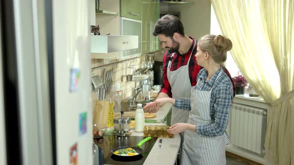 Couple Cooking and Laughing