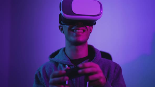 Young gamer playing to new  video games with virtual reality experience