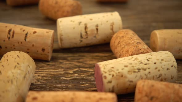 Falling wine corks on old wooden vintage boards. Slow motion.