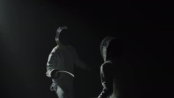Two Professional Fencers Demonstrate Their Mastery of Foil Fencing