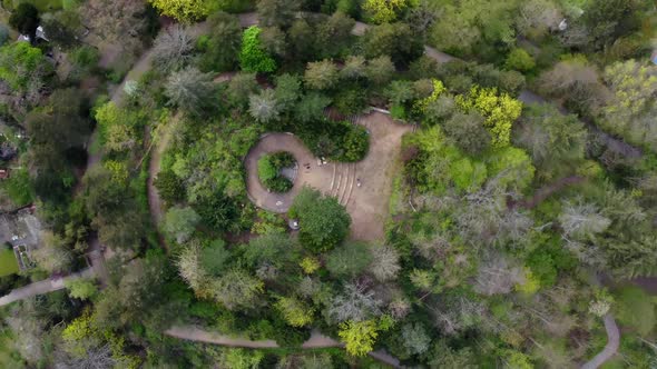 Trees Stairs and a monument Stunning aerial view flight rotation 360 drone shot bird's eye view dron