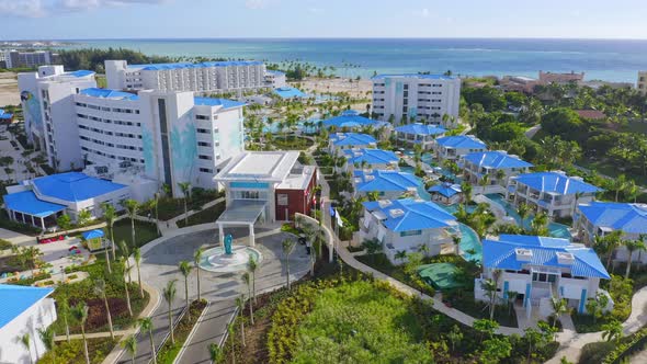 Aerial flyover luxury Tui Blue Hotel Resort in summer with Caribbean Sea in background