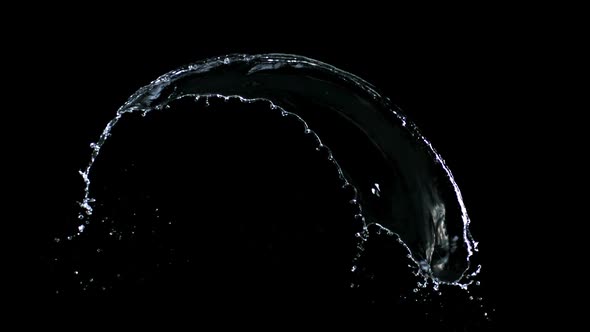 Slow-motion splash water against black drop shooting with high speed camera, phantom flex.