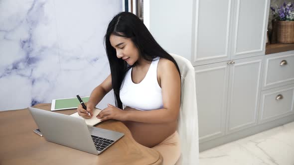 Young Husband Help Pregnant Wife Remove Packaging After Checking Ready