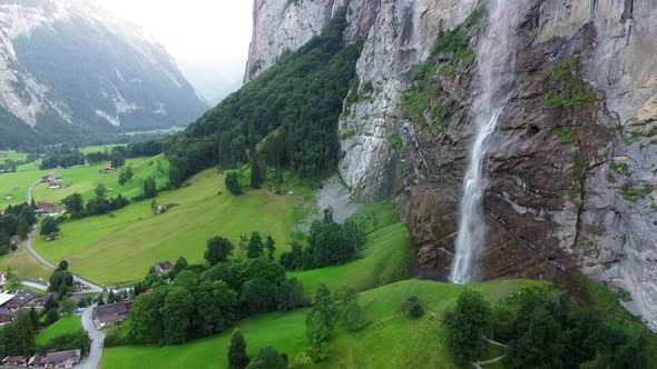 Lauterbrunnen townscape and waterfall above swiss mountain in alps.Tourist destination travel Europe