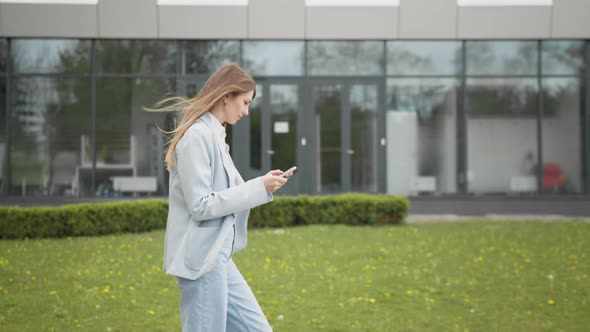 Happy Young Woman Receiving Discount for Shopping While Checking Email Box While