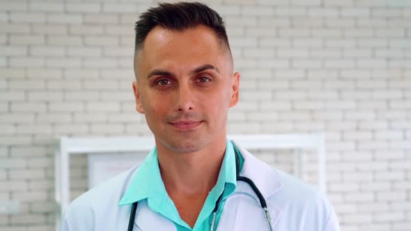 Doctor in Professional Uniform Examining Patient at Hospital