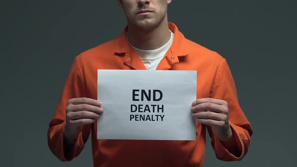 End Death Penalty Phrase on Cardboard in Hands of Caucasian Prisoner, Protest