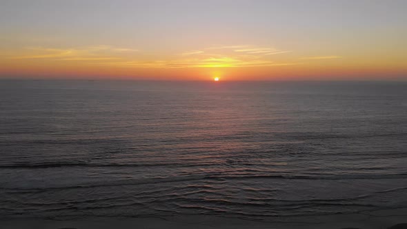 Orange Sunset Pacific Ocean (La Serena, Chile) aerial view, drone footage