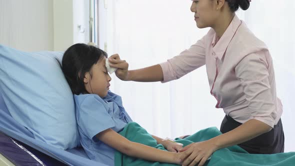 Mother rub the body patient little girl