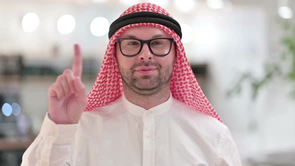 Young Arab Businessman Saying No By Finger Sign