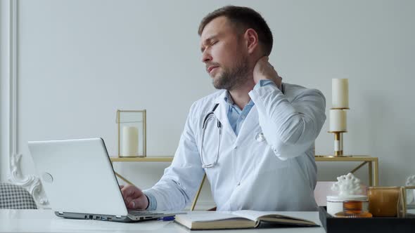 Man Doctor is Stressed and Tired From Hard Work to Take Care of Patients