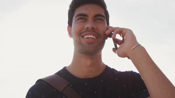 Young man talking on the phone