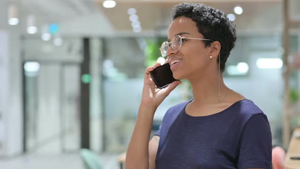 Portrait of Casual African Woman Talking on Smartphone