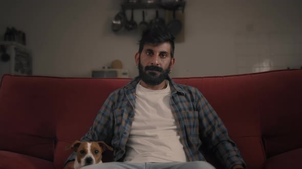 Portrait of a man sitting on sofa