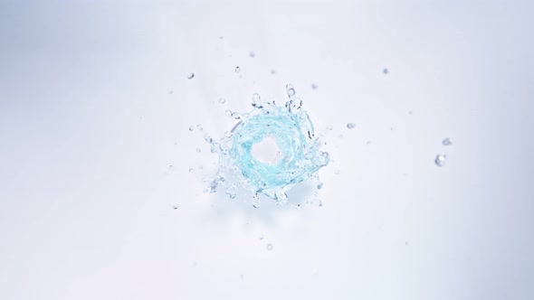 Super Slow Motion Shot of Water Vortex Splash Isolated on Light Blue Background at 1000Fps