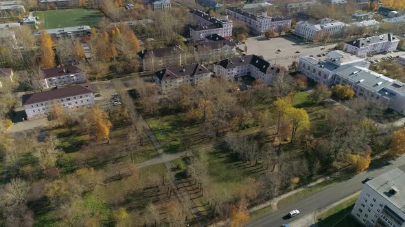 Aerial view of park next to house of culture and three-story and five-story houses 54