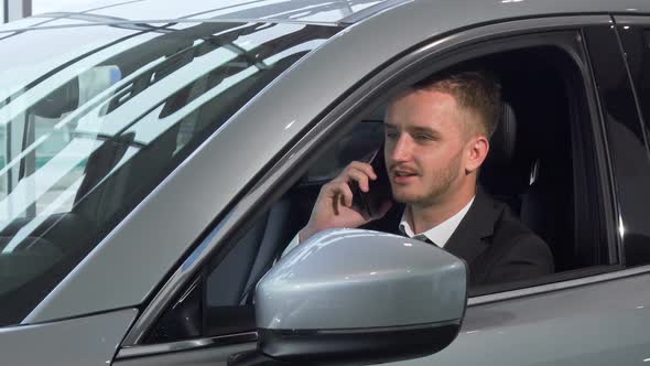 Businessman Talking on the Phone, Sitting in a New Automobile 1080p