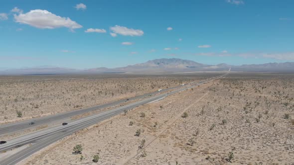 Falling aerial of the highway leading from Barstow, California to Las Vegas, Nevada