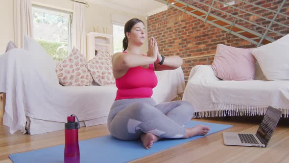 Caucasian vlogger female exercising at home