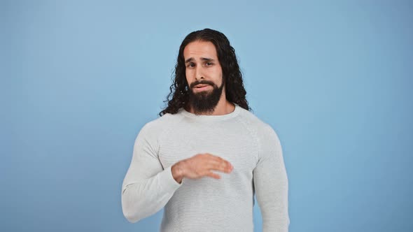 Studio Shot of Young Bored Man Showing Fed Up Gesture Looking Tired and Displeased Blue Studio