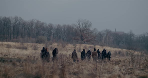 Refugees Walking On Road During War Crisis