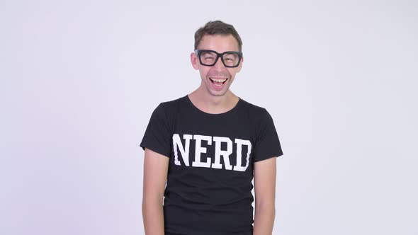 Studio Shot of Happy Nerd Man Laughing and Pointing To Camera