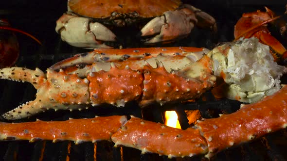 King Crab Legs and Dungeness Crab on the Grill with Butter