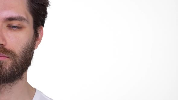 Young Man Opening Eyes Smiling Half Face on White Background