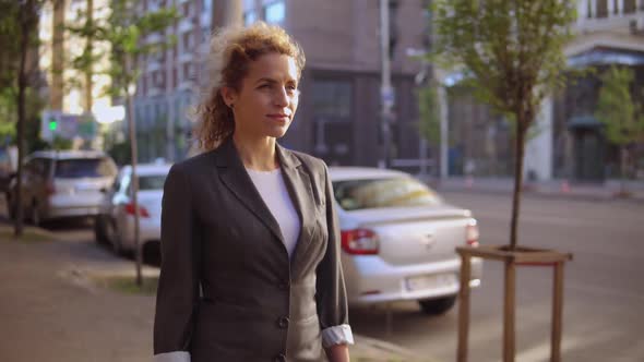 Businesswoman Walks in Urban City