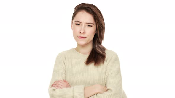 Portrait of Serious Young Woman Posing at Camera with Crossed Arms Feeling Negative Answering NO