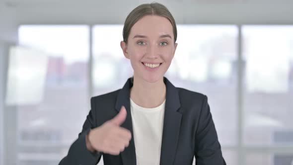 Portrait of Ambitious Young Businesswoman Doing Thumbs Up