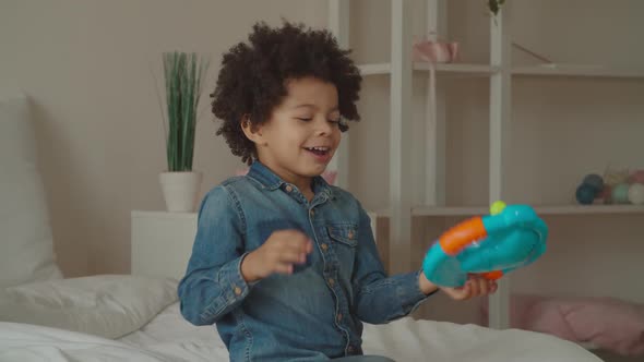 Mixed Race Boy Playing with Toy Steering Wheel