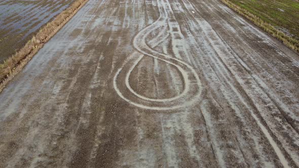 Aerial view the trace mark of tractor plowing in wetland