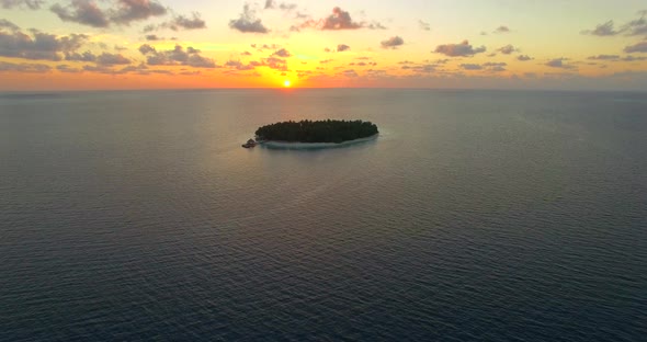 Aerial drone view of scenic tropical islands at sunset in the Maldives