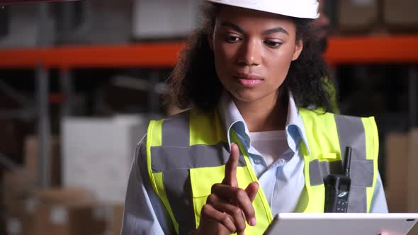 Warehouse Supervisor During Stocktaking on Tablet