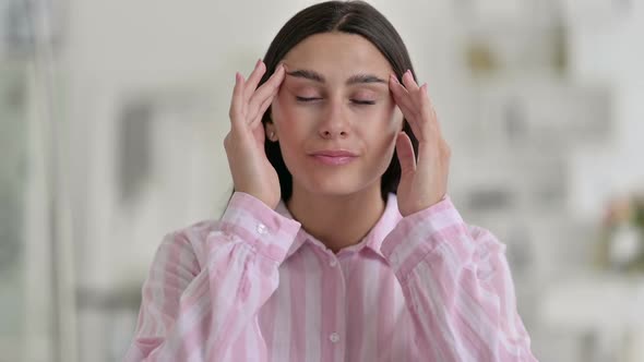 Portrait of Exhausted Young Latin Woman Having Headache