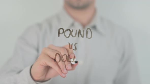 Pound Vs Dollar Writing on Screen with Hand