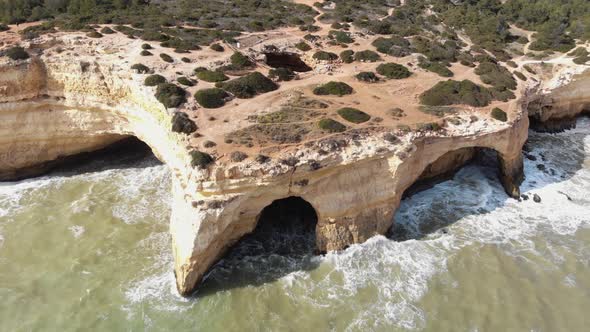 High angle aerial view of Benagil caves by the Atlantic ocean, Lagoa, Algarve, Portugal
