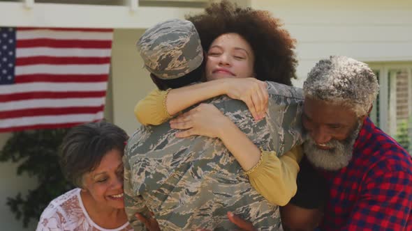 African American man coming back home with his family