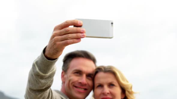 Mature couple taking a selfie from mobile phone