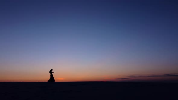 Graceful Movements of a Dancer, Dancing Belly Dance While on the Beach. Silhouettes